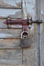 Padlock on a old wooden door. Royalty Free Stock Photo