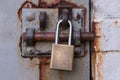 Padlock on Rusty Bolted Door Royalty Free Stock Photo