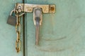 Padlock with rusty chains and green background vintage style