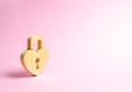 Padlock in the shape of a heart on a pink background. The secret of relationships and pickup rules. The concept of female intimate Royalty Free Stock Photo