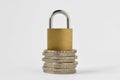 Padlock on stack of coins on white background - Concept of financial security Royalty Free Stock Photo