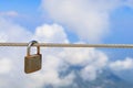 Padlock on a steel rope, selective focus. Background with copy space Royalty Free Stock Photo