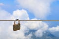 Padlock on a steel rope, selective focus. Background with copy space Royalty Free Stock Photo