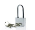 Padlock with three keys on white background Royalty Free Stock Photo