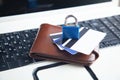 Padlock, wallet and credit cards on the computer keyboard. Credit card security Royalty Free Stock Photo