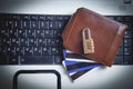 Padlock, wallet and credit cards on the computer keyboard. Credit card security Royalty Free Stock Photo