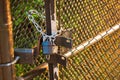 Padlock on wire fence Royalty Free Stock Photo