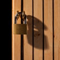 Padlock on wooden door