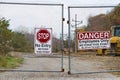 Locked gate and signs Royalty Free Stock Photo