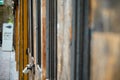 Padlocked old wooden doors. Shallow focus