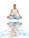 Padmasana lotus pose on white sand