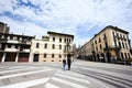 Padova, Italy- July, 05, 2022: Multicolored couple holding hands walking in street of Padua, Veneto, Italy