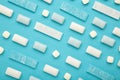Pads of chewing gum on blue background. Fresh mint bubble gum Royalty Free Stock Photo