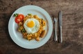 Pad Thai noodles with Omelette and tomato on wooden table Royalty Free Stock Photo