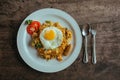 Pad Thai noodles with Omelette and tomato on wooden table
