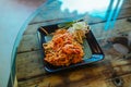 Pad Thai noodles with Seafood and nuts on the table