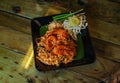 Pad Thai noodles with Seafood and nuts on the table