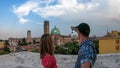 Padua - Couple clinking prosecco glasses with scenic view on Basilica di Santa Maria del Carmine in Padua, Veneto, Italy, Europe