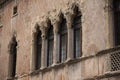 Old mullioned windows in Venetian style tuff Royalty Free Stock Photo