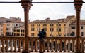 Padua -  Tourist man enjoying the view on Piazza delle Erbe from the loggia of Palazzo della Ragione in Padua, Veneto, Italy Royalty Free Stock Photo