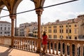 Padua -  Tourist woman enjoying the view on Piazza delle Erbe from the loggia of Palazzo della Ragione in Padua, Veneto, Italy Royalty Free Stock Photo