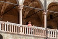 Padua -  Tourist woman enjoying the view on Piazza delle Erbe from the loggia of Palazzo della Ragione in Padua, Veneto, Italy Royalty Free Stock Photo