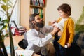 Paediatrician doctor examining a child in comfortabe medical office Royalty Free Stock Photo