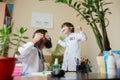 Paediatrician doctor examining a child in comfortabe medical office Royalty Free Stock Photo