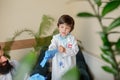 Paediatrician doctor examining a child in comfortabe medical office Royalty Free Stock Photo