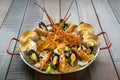 Paella with fresh lobster, scollops, mussels and prawn Royalty Free Stock Photo