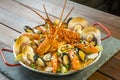 Paella with fresh lobster, scollops, mussels and prawn Royalty Free Stock Photo