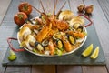 Paella with fresh lobster, scollops, mussels and prawn Royalty Free Stock Photo