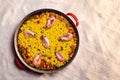 Paella over the sand of the beach Royalty Free Stock Photo