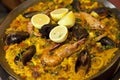 Paella with rice shrimps and mussels in pan Royalty Free Stock Photo