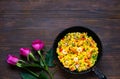 Paella with seafood on wooden background.National Spanish and Valencian rice dish. Festive background concept for