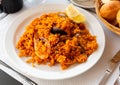 Paella with shrimps, mussels and lemon Royalty Free Stock Photo