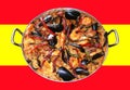 Paella on the spanish flag in the background Royalty Free Stock Photo