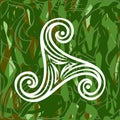 Pagan celtic symbol triskele on green grass background