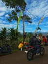 Pagar Alam, South Sumatra Indonesia-July 7, 2023: the electrician is changing a burnt out street light bulb