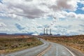Page Arizona power plant. Long winding highway in the american desert, blue sky with clouds Royalty Free Stock Photo