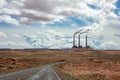 Page Arizona power plant. Long winding highway in the american desert, blue sky with clouds Royalty Free Stock Photo