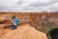 PAGE, ARIZONA, USA - APRIL 2016: Tourist at Horseshoe Bend lookout point on Colorado River in Glen Canyon, part of Grand canyon,