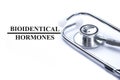 Page with bioidentical hormones on the table with stethoscope, m Royalty Free Stock Photo
