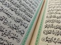 page on the contents of the Koran with Arabic writing with a blur effect