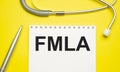 Page with FMLA Family Medical Leave Act on the table with stethoscope Royalty Free Stock Photo