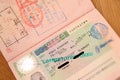 Page of a foreign passport with filled in personal details and cancellation of a Schengen visa, concept of visa problems of