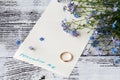 Page of a notebook, there is a bouquet of forget-me-nots on it a Royalty Free Stock Photo