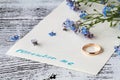Page of a notebook, there is a bouquet of forget-me-nots on it a Royalty Free Stock Photo