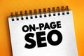 On-page SEO - process of optimizing pages on your site to improve rankings and user experience, text concept on notepad