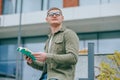 Page Turner Portrait of a Young Male with eyeglasses Sitting and Reading Royalty Free Stock Photo